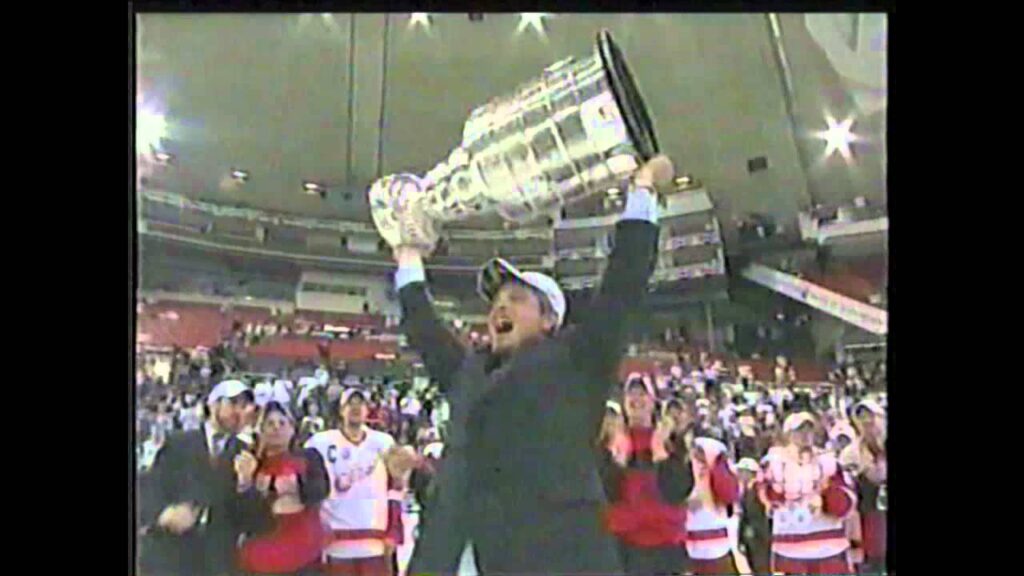 todd mclellan hoisting the stanley cup as a redwing