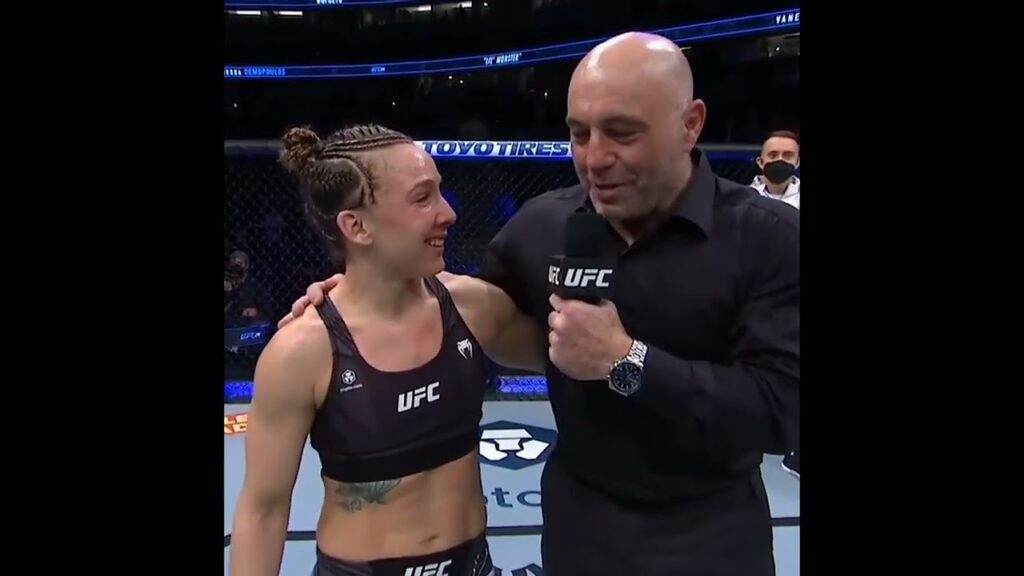 vanessa demopoulos jumps in joe rogans arms during post fight interview