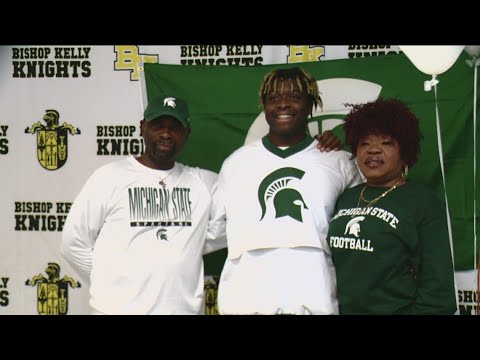 bishop kelly star ol rakeem johnson signs with michigan state