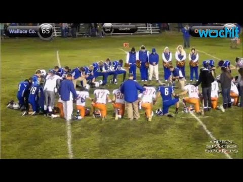 high school football player dies on field after scoring touch down