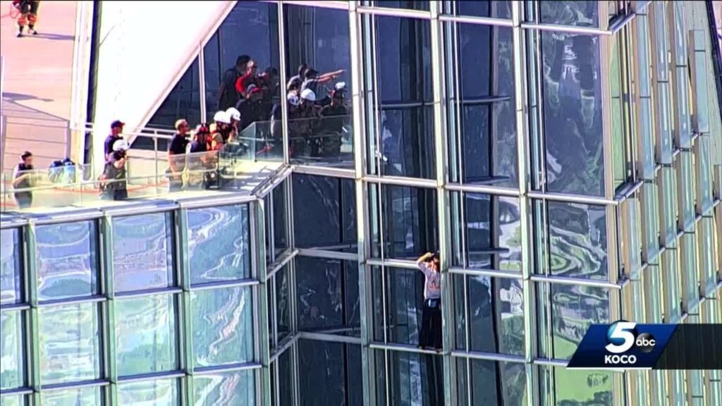 oklahoma city firefighters guide climber at devon tower to safety