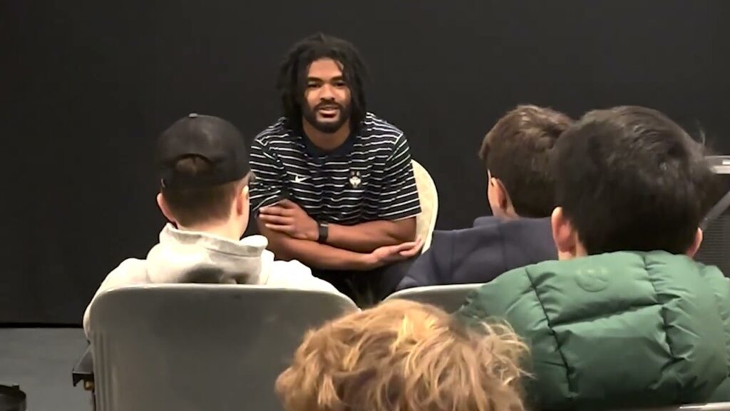 rumsey hall students visit with with uconn football player chris shearin at bantam cinema arts