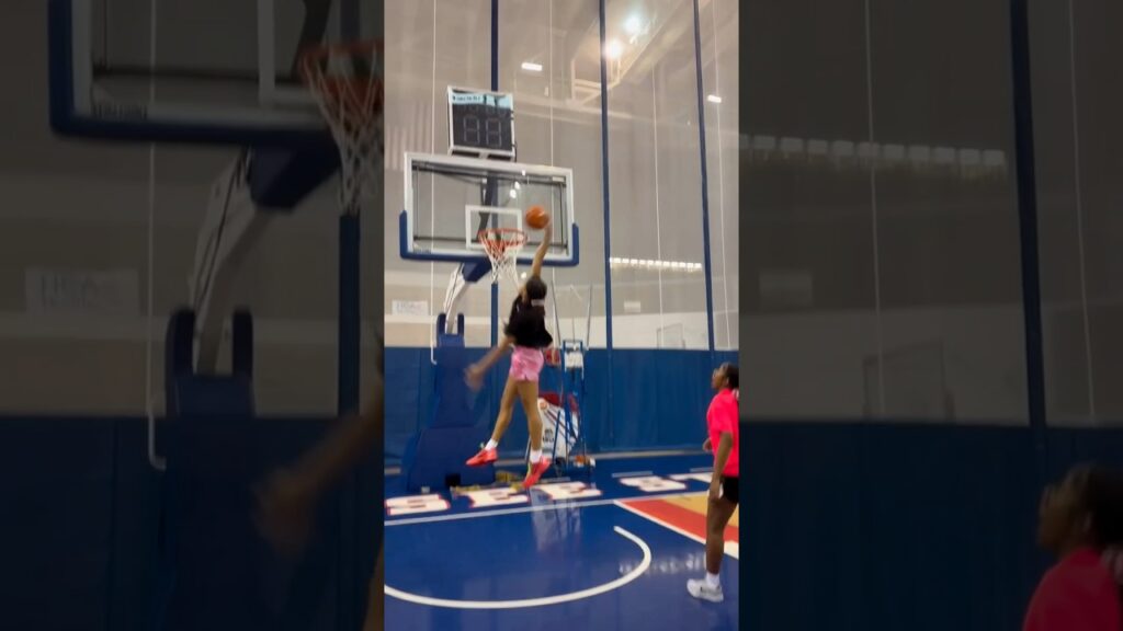 khamil pierre dunks while hooping in the gym